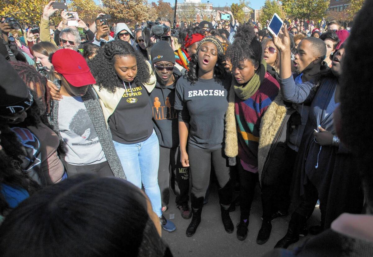 Students celebrate after the resignation of University of Missouri President Timothy M. Wolfe on Monday. He stepped down amid criticism of his handling of racial issues.