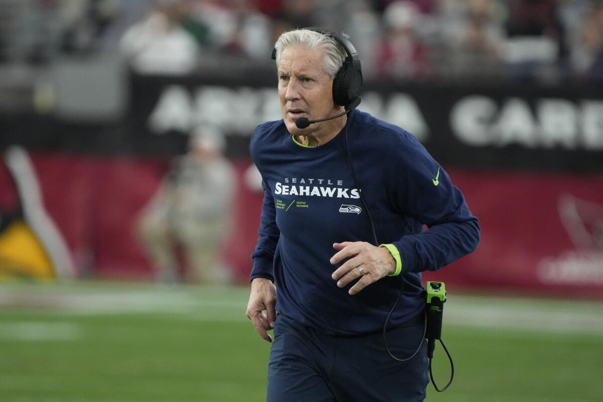 Seattle Seahawks coach Pete Carroll walks on the sideline during a game against the Arizona Cardinals on Jan. 8.
