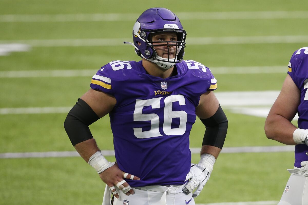 FILE - Minnesota Vikings center Garrett Bradbury (56) plays against the Atlanta Falcons during the second half of an NFL football game, Oct. 18, 2020, in Minneapolis. The Vikings declined the fifth-year option on the contract for Bradbury on Monday, May 2, 2022, sending their 2019 first-round draft pick into the final season of his rookie deal. (AP Photo/Bruce Kluckhohn, File)