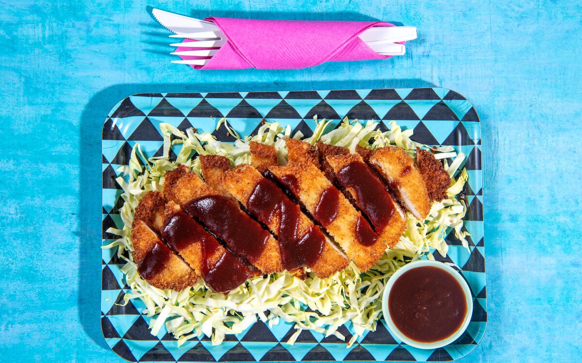 Chicken katsu is breaded and served with a tangy sauce