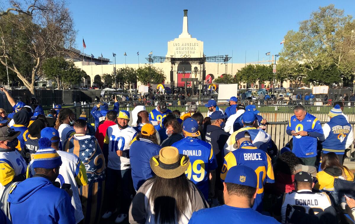 Rams fans gather in Exposition Park for the Rams' victory parade and celebration Wednesday