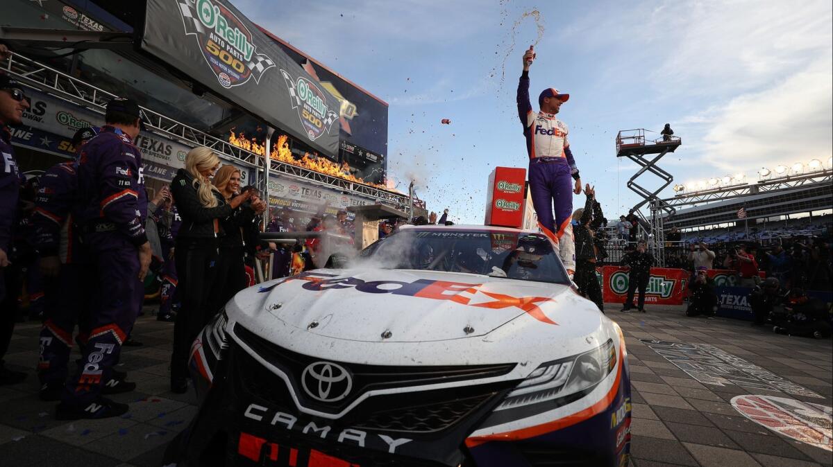 Denny Hamlin celebrates in victory lane after winning Sunday's NASCAR race at Texas Motor Speedway.