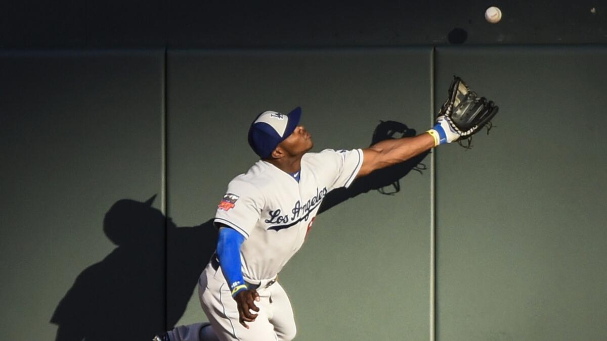 Dodgers right fielder Yasiel Puig can't make a catch on a run-scoring triple by the Angels' Mike Trout during the MLB All-Star Game on July 15. Will the Dodgers move Puig to center field?