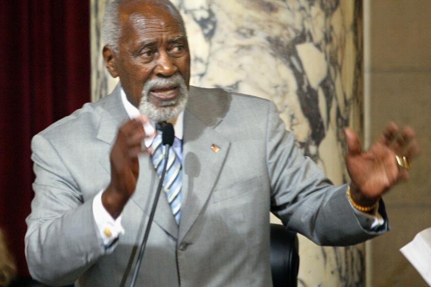 Los Angeles city councilman Nate Holden addresses the city council in favor of renaming Crenshaw Blvd after former Mayor Tom Bradley. Digital image taken on 06/25/03