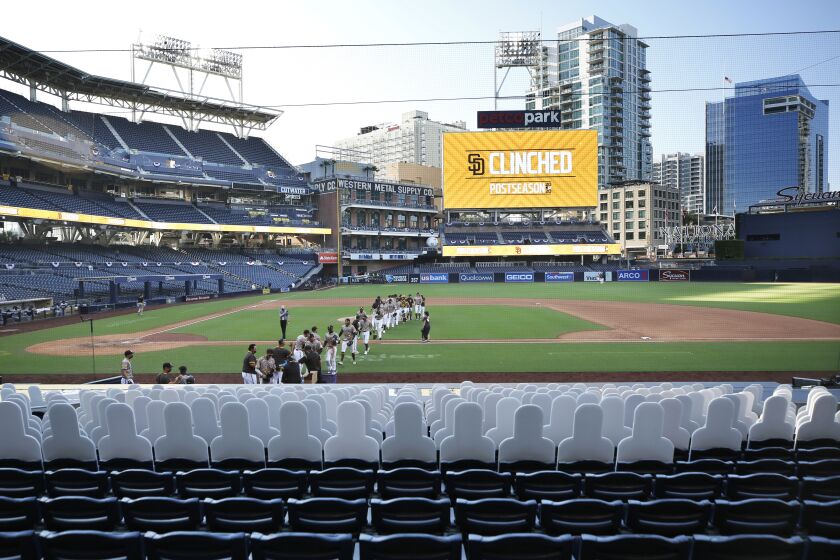 SAN DIEGO, CA - SEPTEMBER 20: The San Diego Padres celebrate after beating the Seattle Mariners and clinching a playoff spot at Petco Park on Sunday, Sept.20, 2020 in San Diego, CA. (K.C. Alfred / The San Diego Union-Tribune)