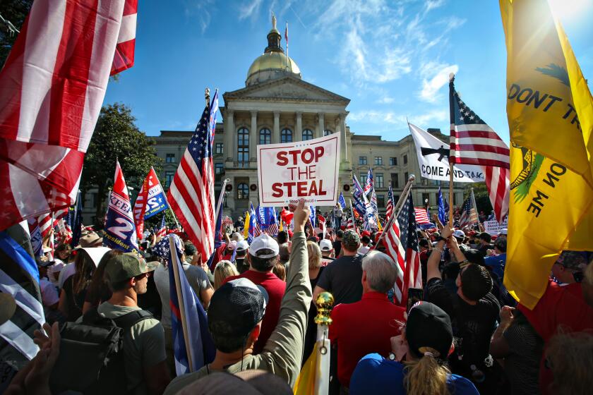ATLANTA, GA - NOVEMBER 21: Hundreds of Trump supporters and gather near the Capitol Building for the Stop the Steal Rally in Atlanta, GA. as well as counter protesters in Atlanta, GA. (Jason Armond / Los Angeles Times)