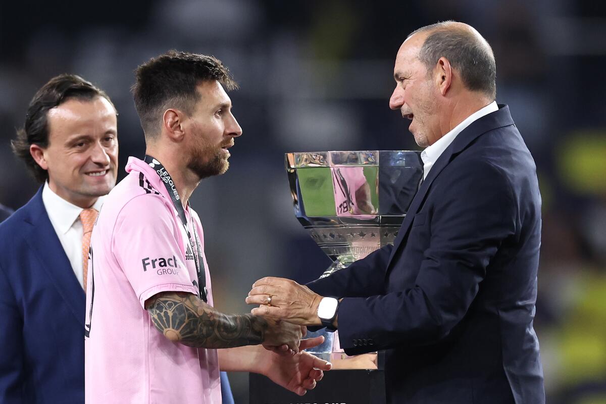 Inter Miami star Lionel Messi shakes hands with MLS commissioner Don Garber after his team won the 2023 Leagues Cup