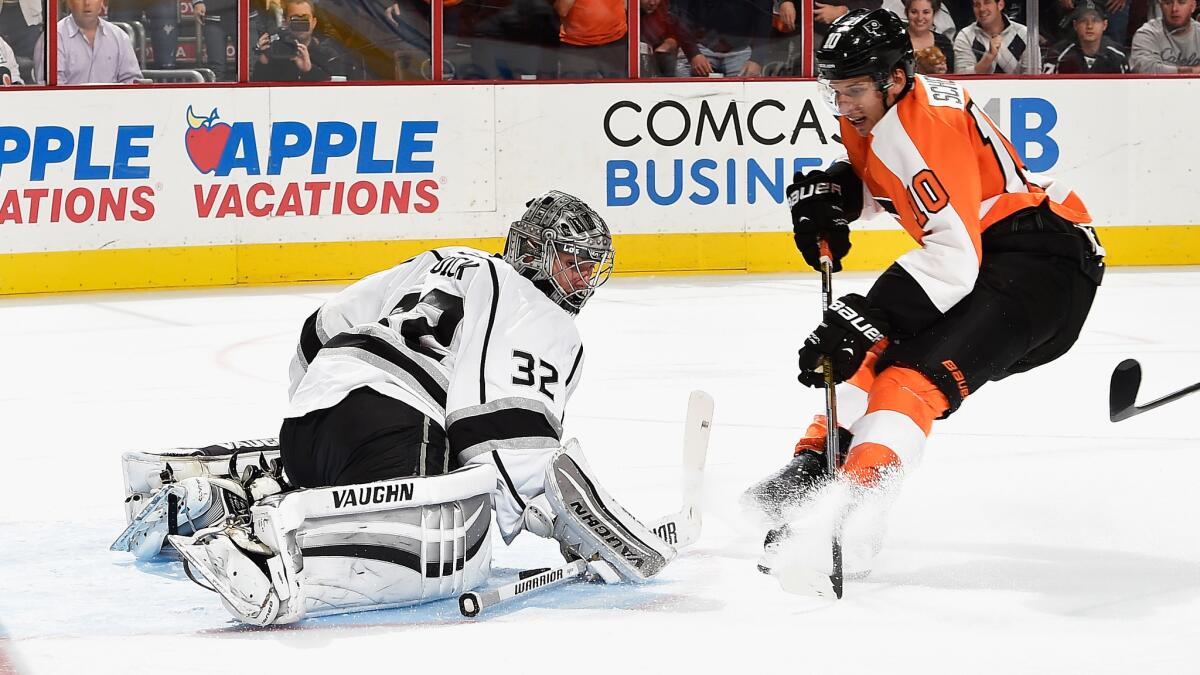 Philadelphia Flyers forward Brayden Schenn, right, scores on Kings goalie Jonathan Quick in overtime to lift the Flyers to a 3-2 win.