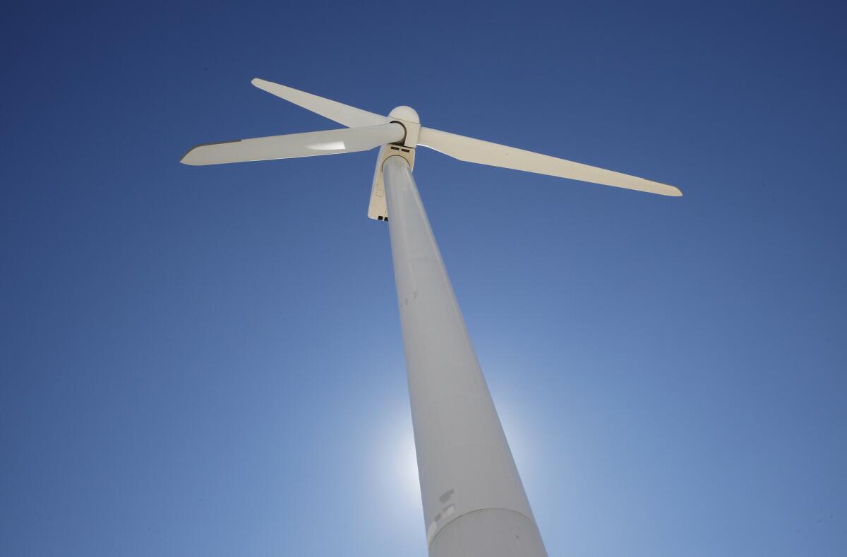 A wind turbine generates electricity during the unveiling of the Desert Renewable Energy Conservation Plan at the AES mountain view wind farm in the San Gorgonio Pass in Palm Springs.