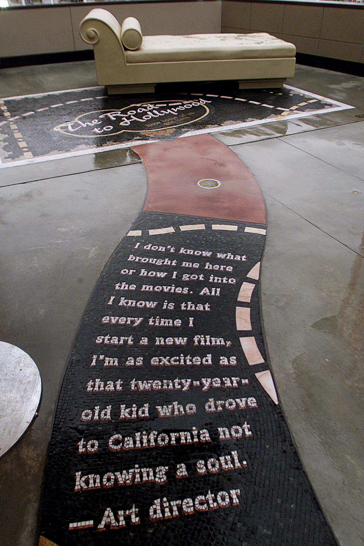 A "Road to Hollywood" tile mosaic quotes an art director recalling how he came to California "not knowing a soul." 