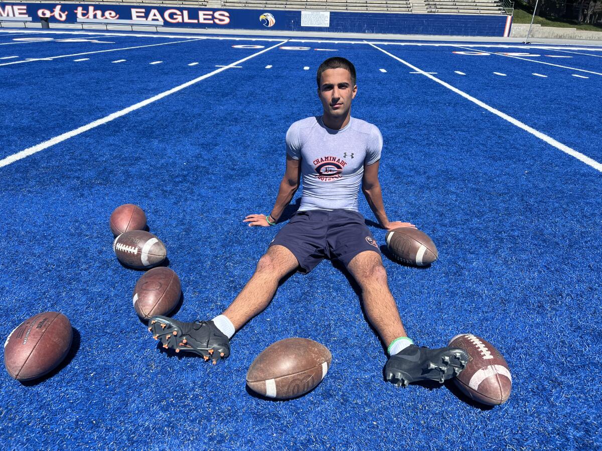 Chaminade kicker Ryon Sayeri poses for a photo sitting on the school's blue football turf.