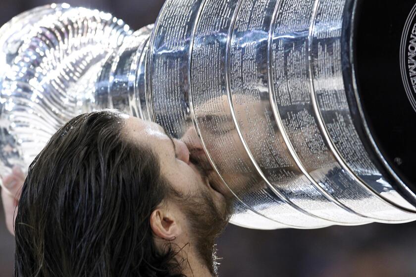 Forward Kevin Westgarth kisses the Stanley Cup after the Kings defeated the Devils, 6–1, to win the 2012 Stanley Cup championship.