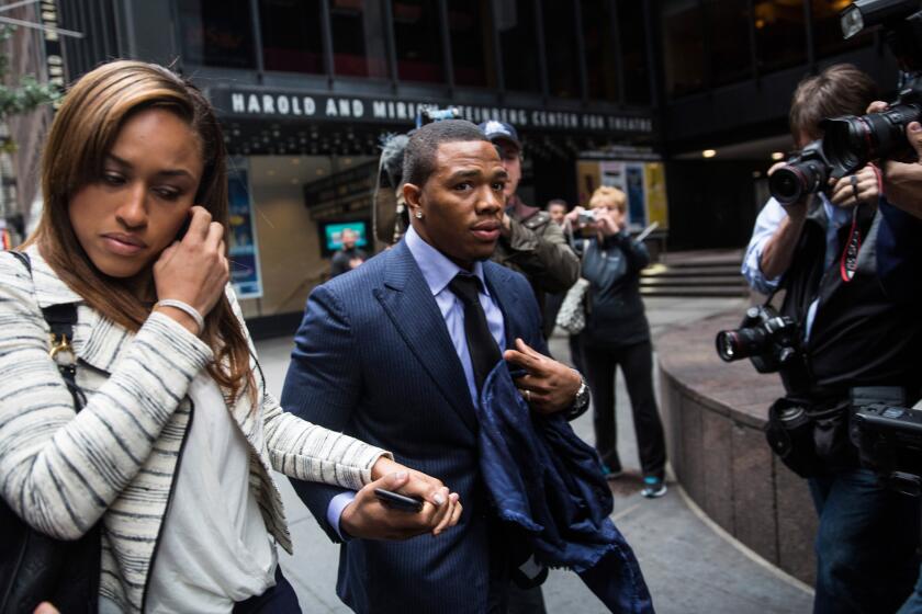 Former Baltimore Ravens football player Ray Rice and his wife Janay arrive for a hearing on Nov. 5, in New York City. Rice's suspension was overturned Friday. Janay told ESPN she was thankful.