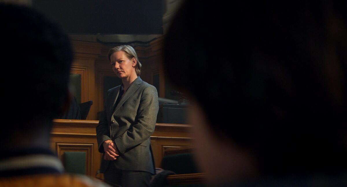 A woman stands in a courtroom in "Anatomy of a Fall."