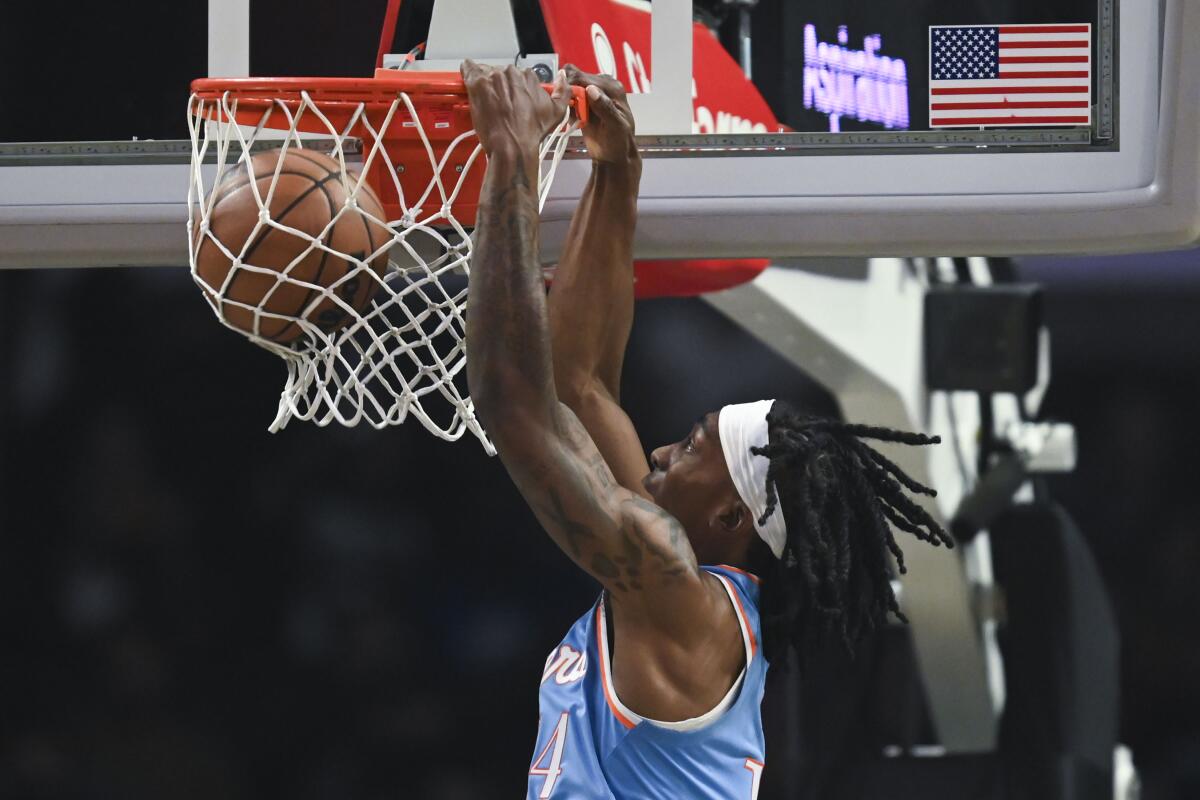 The Clippers' Terance Mann dunks during the first half Nov. 13, 2021.