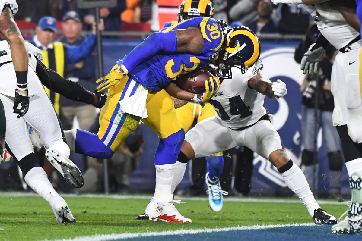 Rams running back Todd Gurley scores a touchdown against the Eagles during the first quarter Sunday.