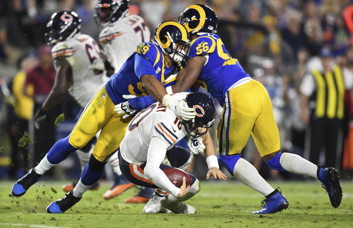 Aaron Donald (99) and Dante Fowler Jr. combine for a sack of Bears quarterback Mitch Trubisky in the fourth quarter, but a penalty wiped out the play. 