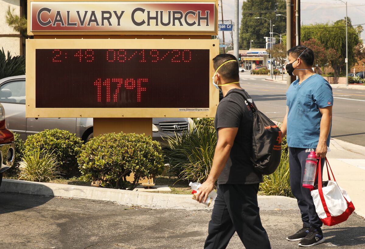 The thermometer at Calvary Church in Woodland Hills registers 117 degrees during a heat wave last month.