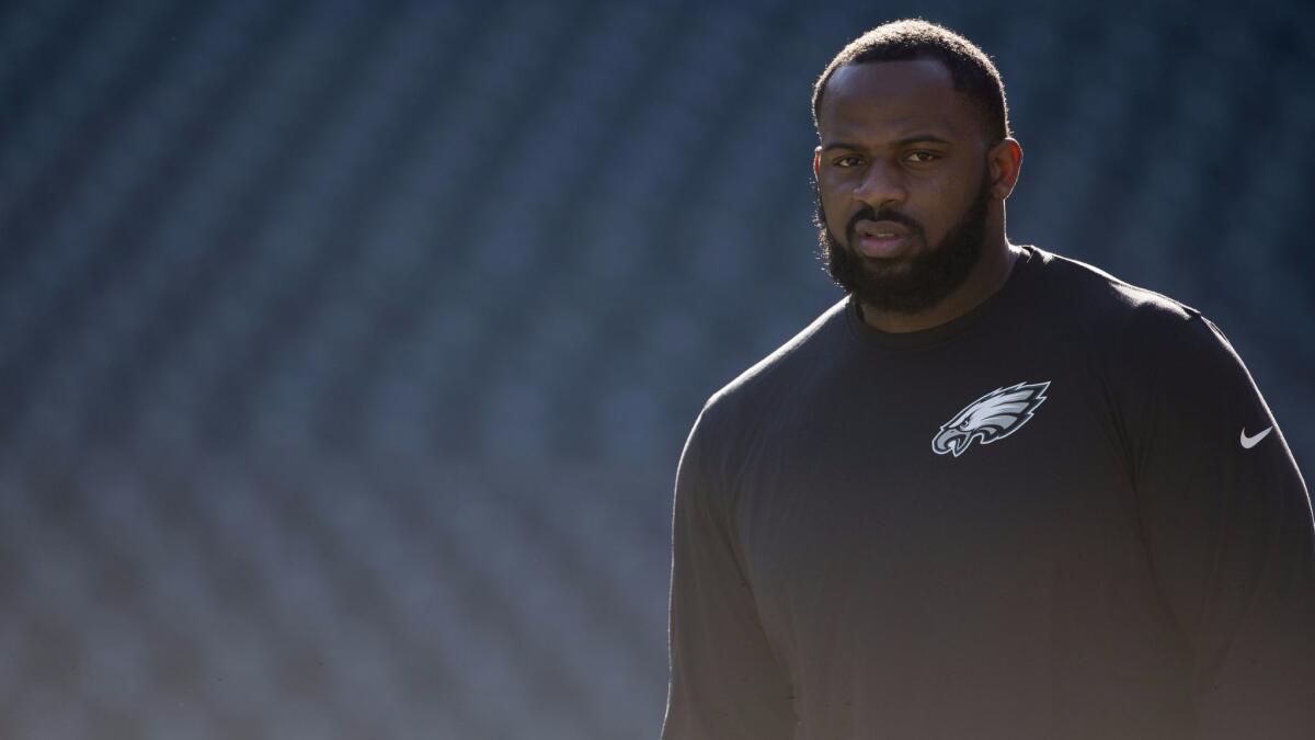 Fletcher Cox of the Philadelphia Eagles walks onto the field prior to the game against the Chicago Bears at Lincoln Financial Field.