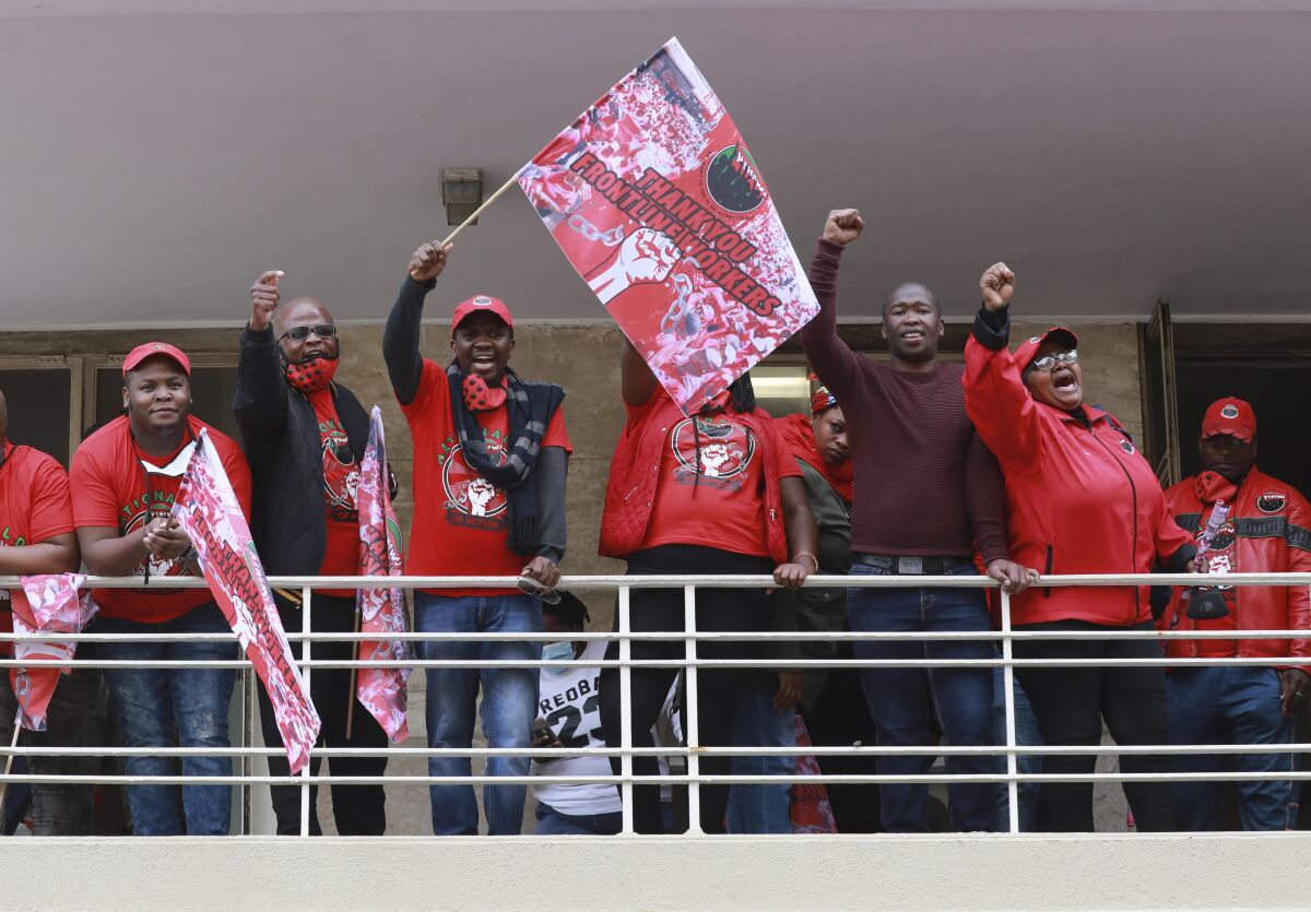 Members of the National Education, Health and Allied Workers' Union (NEHAWU) protest in Cape Town, South Africa, Thursday Sept. 3, 2020. NEHAWU are calling for safer working conditions for front line workers after 240 lost their lives to COVID-19. (AP Photo/Nardus Engelbrecht)