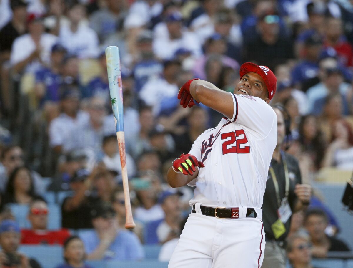 Washington Nationals star Juan Soto tosses his bat during the All-Star Home Run Derby.