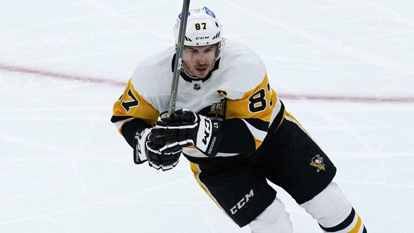 Pittsburgh Penguins center Sidney Crosby skates down ice against the Boston Bruins during the first period of an NHL hockey game, Tuesday, Feb. 8, 2022. (AP Photo/Charles Krupa)
