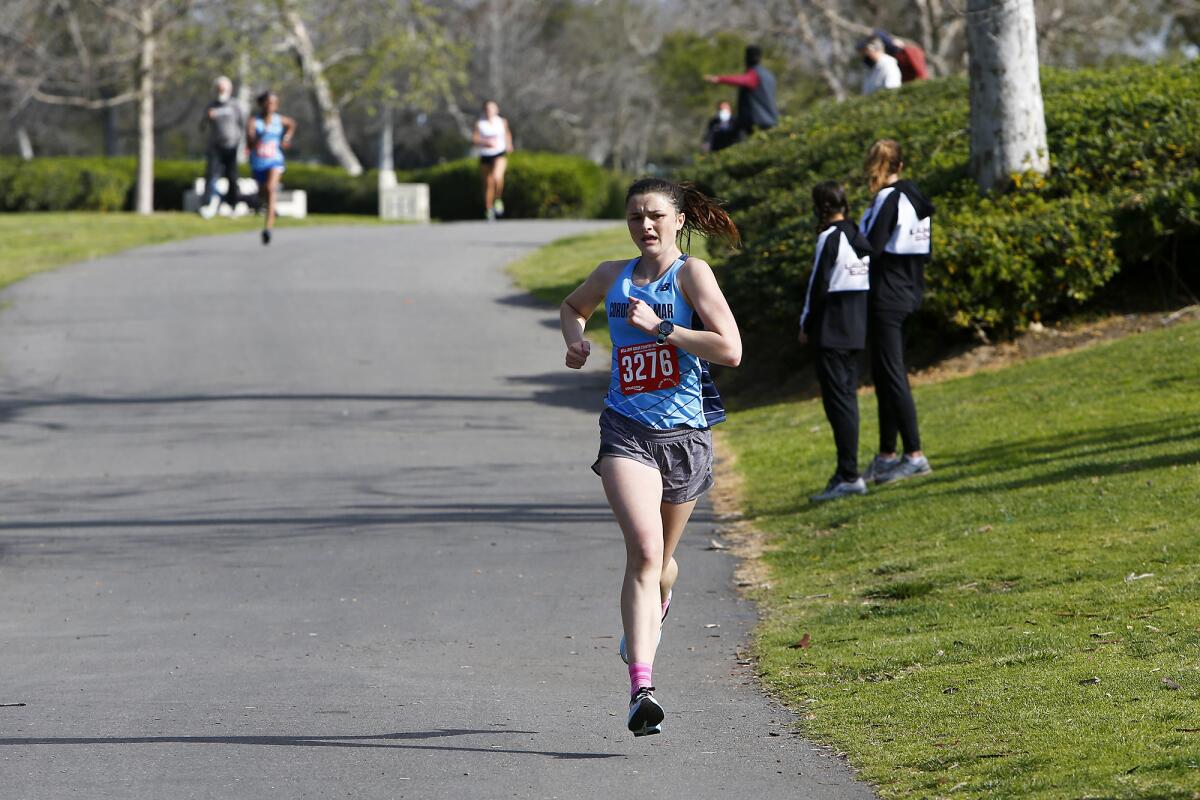 Corona del Mar's Annabelle Boudreau finishes fourth against Laguna Beach during a cross-country dual meet at Central Park.