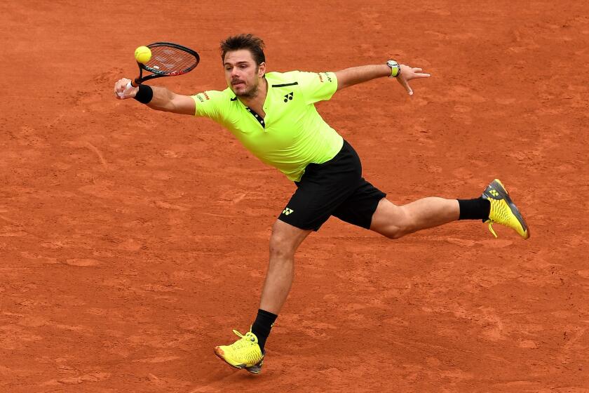 Stan Wawrinka hits a forehand during the his French Open first round match against Lukas Rosol on May 23.