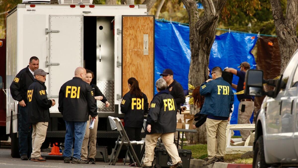 FBI agents search the home of Stephen Beal, who is charged in connection with a fatal blast at an Aliso Viejo day spa that killed his ex-girlfriend, in May 2018.