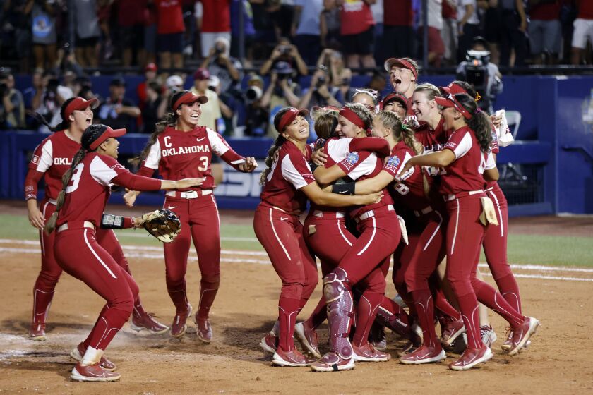 Oklahoma players celebrate after winning the second game of the NCAA Women's College World Series softball championship series over Florida State, Thursday, June 8, 2023, in Oklahoma City. (AP Photo/Nate Billings)