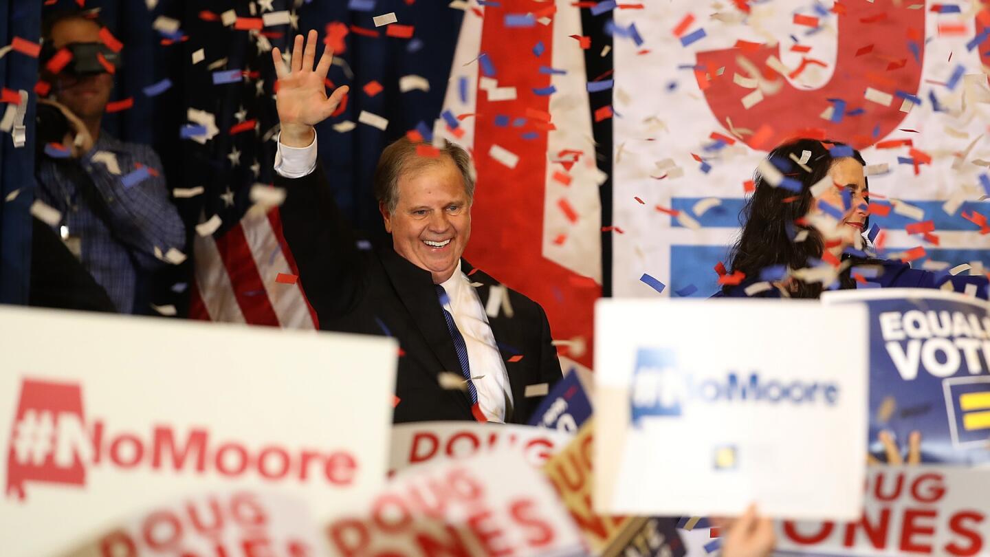 Democratic Sen.-elect Doug Jones greets supporters during his election night party at the Sheraton Hotel in Birmingham after defeating Republican candidate Roy Moore in Alabama.
