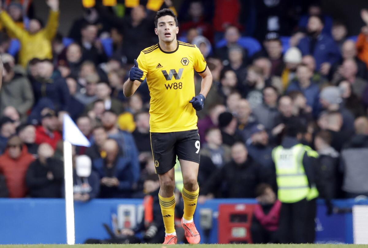 Wolverhampton Wanderers' Raul Jimenez celebrates after scoring his side's opening goal during the English Premier League soccer match between Chelsea and Wolverhampton Wanderers at Stamford Bridge stadium in London, Sunday, March 10, 2019.