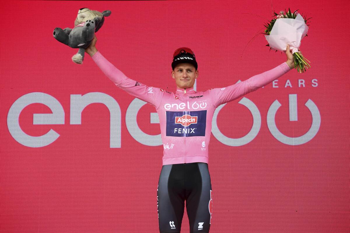 Dutch rider Mathieu van der Poel wears the pink jersey of the overall leader after winning the opening stage of the Giro d'Italia cycling race, from Budapest to Visegrad, Hungary, Friday, May 6, 2022. (Gian Mattia D'Alberto/LaPresse via AP)