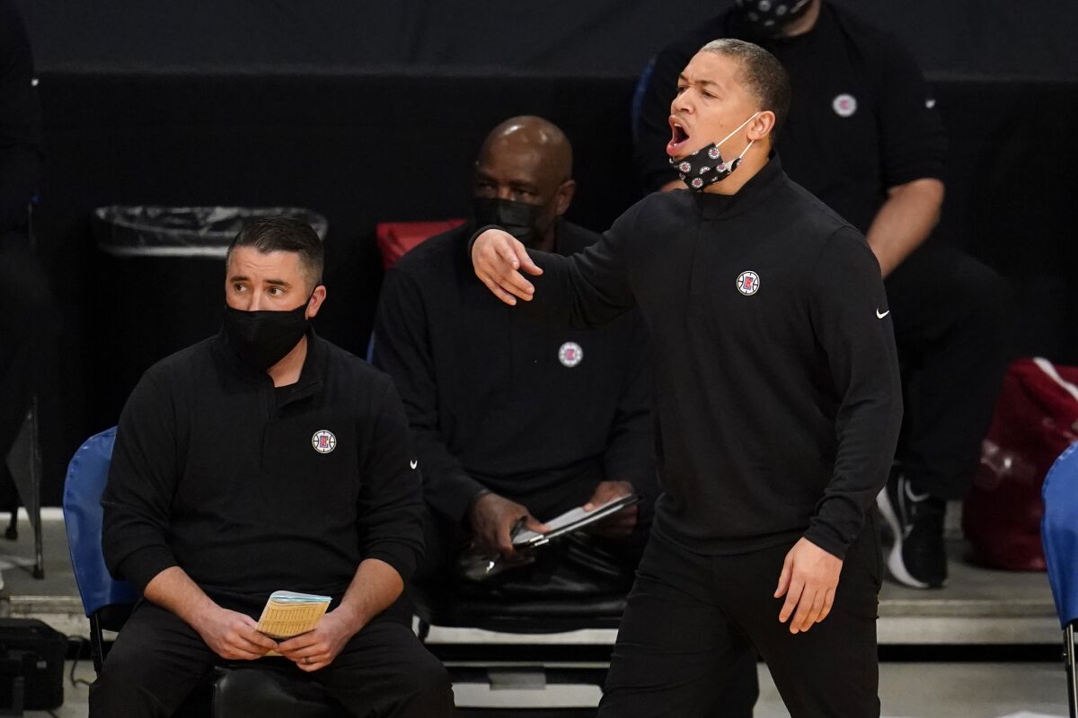 Clippers coach Tyronn Lue yells from the bench during the season opener against the Lakers on Tuesday at Staples Center.