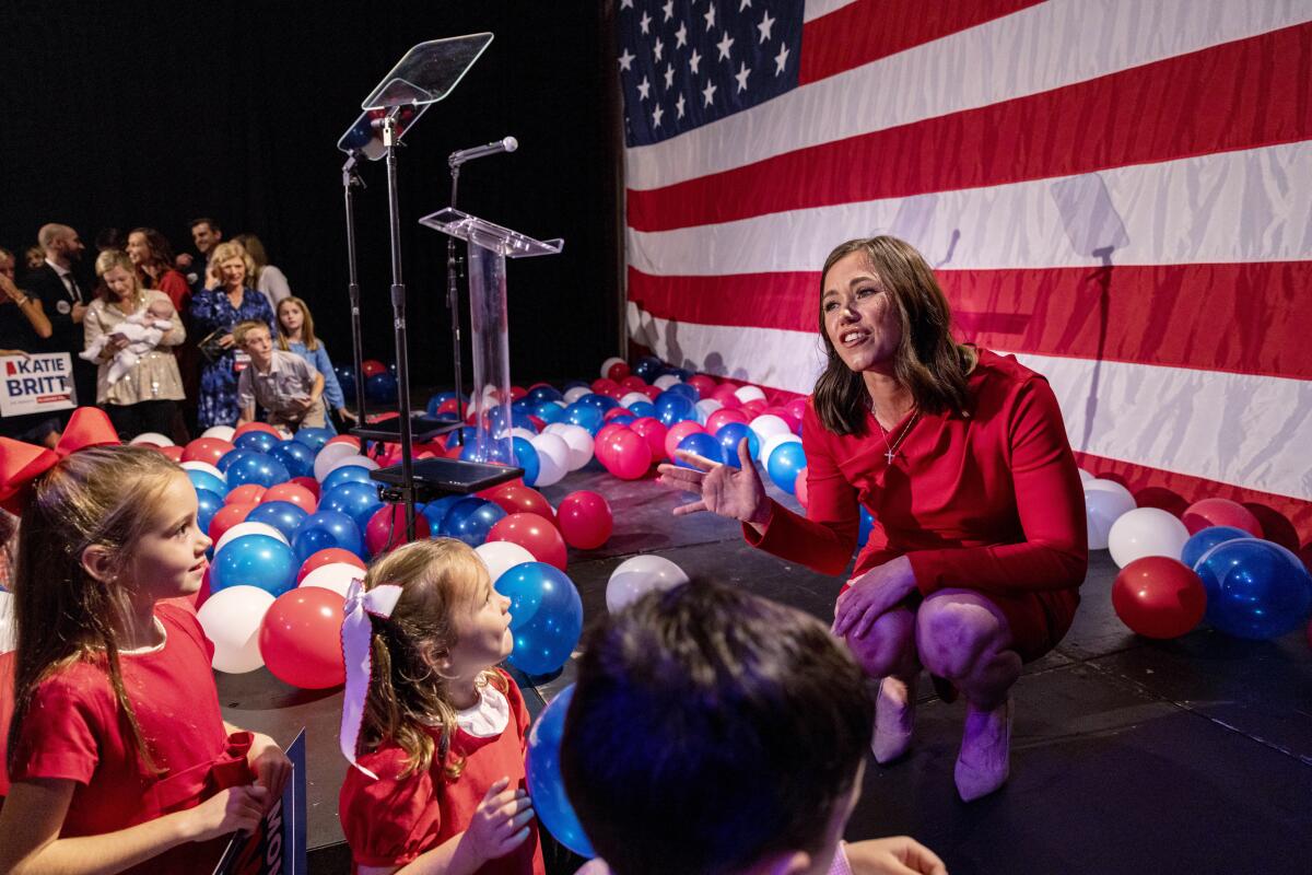 Katie Britt greets young people in the audience at her election-night watch party Tuesday, Nov. 8, 2022, in Montgomery, Ala. Britt won the U.S. Senate race in Alabama, becoming the first woman elected to the body from the state.(AP Photo/Vasha Hunt)