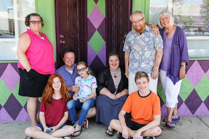 The Haven clan in front of their San Diego apartment building includes, from left, Carla (standing), Molly, 13, dad Matthew, 12-year-old Nate, Amy, 15-year-old Chris and grandparents Clayton and Sharon.