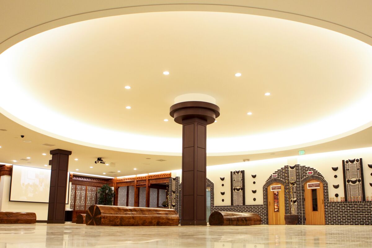 A circular lighted ceiling in the lobby of a spa