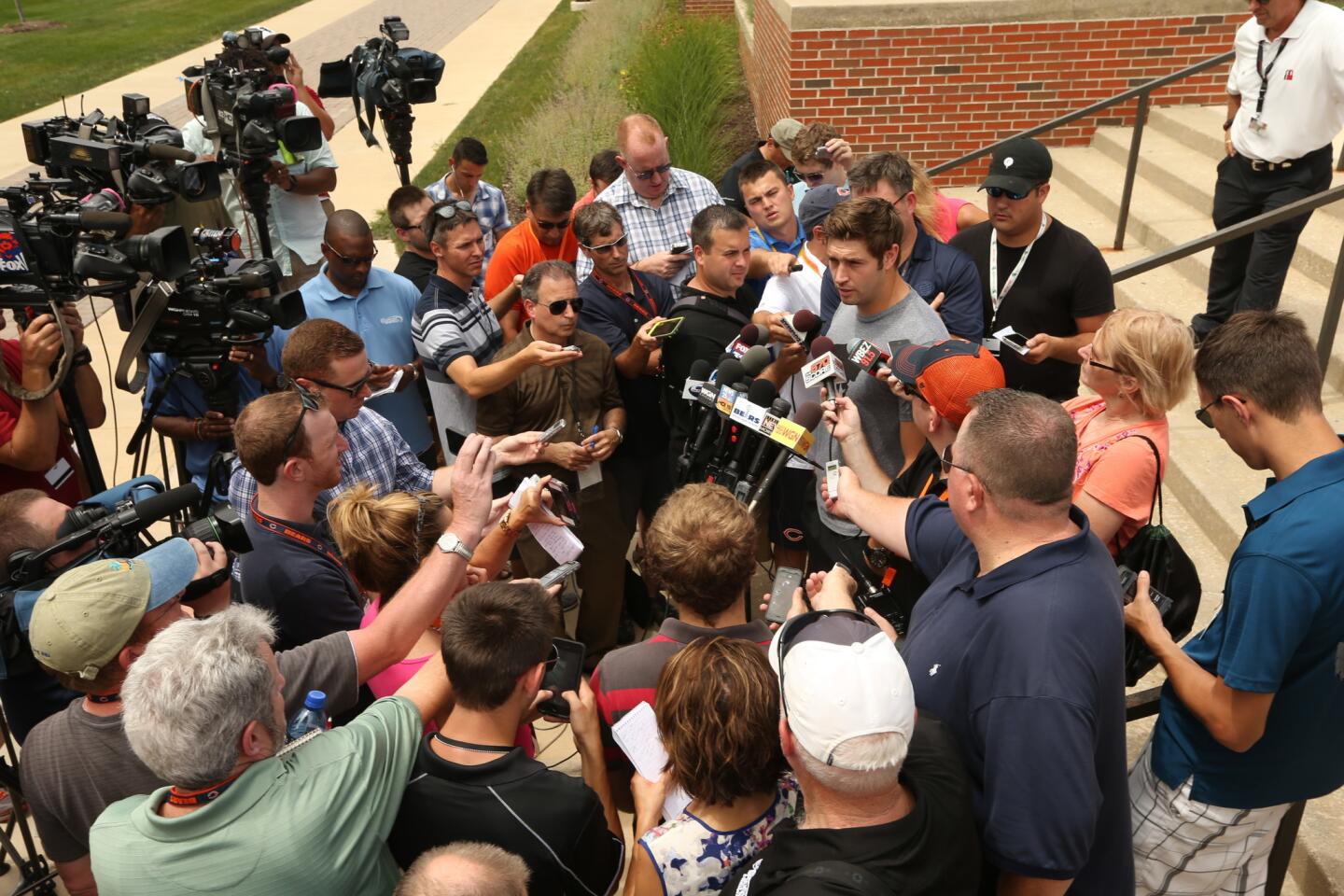 Jay Cutler is surrounded by the media at Bears training camp.