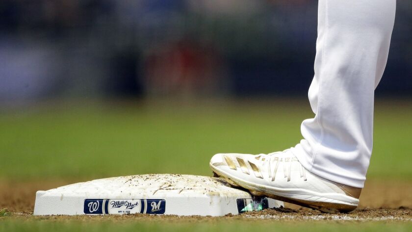 The cleats of Milwaukee Brewers' Ryan Braun are seen during the sixth inning of a game against the Washington Nationals on Wednesday in Milwaukee.