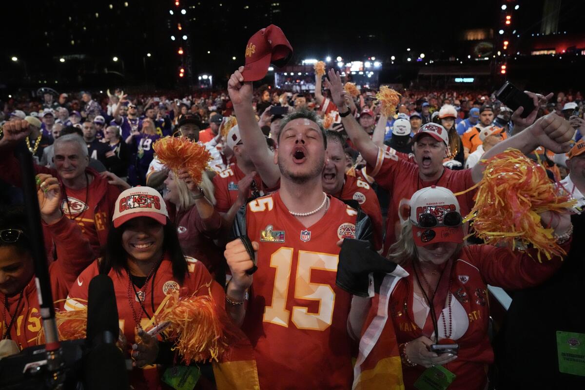 Kansas City Chiefs fans cheer during the first round of the NFL football draft,