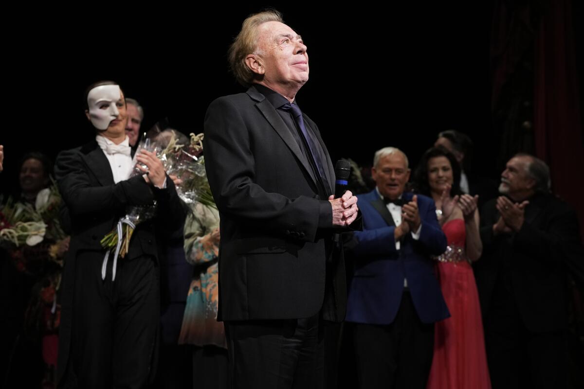 Andrew Lloyd Webber onstage with the 'Phantom of the Opera' cast.