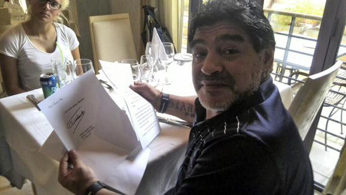 A photo released by Latin American television network Telesur shows former soccer star Diego Maradona of Argentina holding a letter purportedly sent to him by former Cuban President Fidel Castro.
