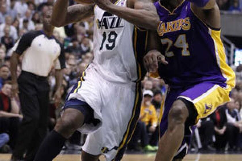 Raja Bell drives past Kobe Bryant during a game last season.