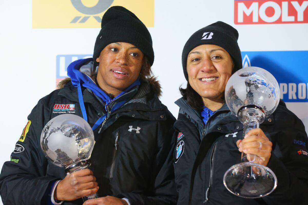Lauren Gibbs, left, and Elana Meyers Taylor receiver third-place trophies at the IBSF World Cup in Koenigssee, Germany, on Jan. 19.