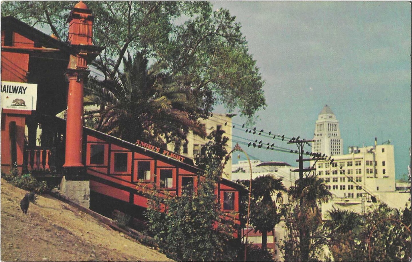 A postcard from the 1960s shows Angels Flight in operation with City Hall in the background.