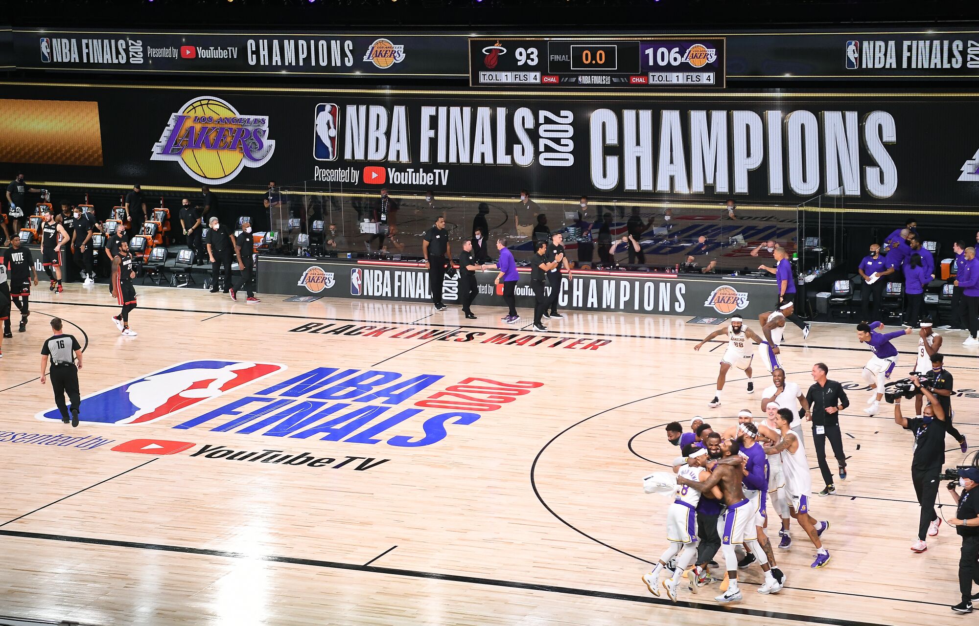 The Lakers celebrate after defeating the Miami Heat to win the NBA championship on Oct. 11.