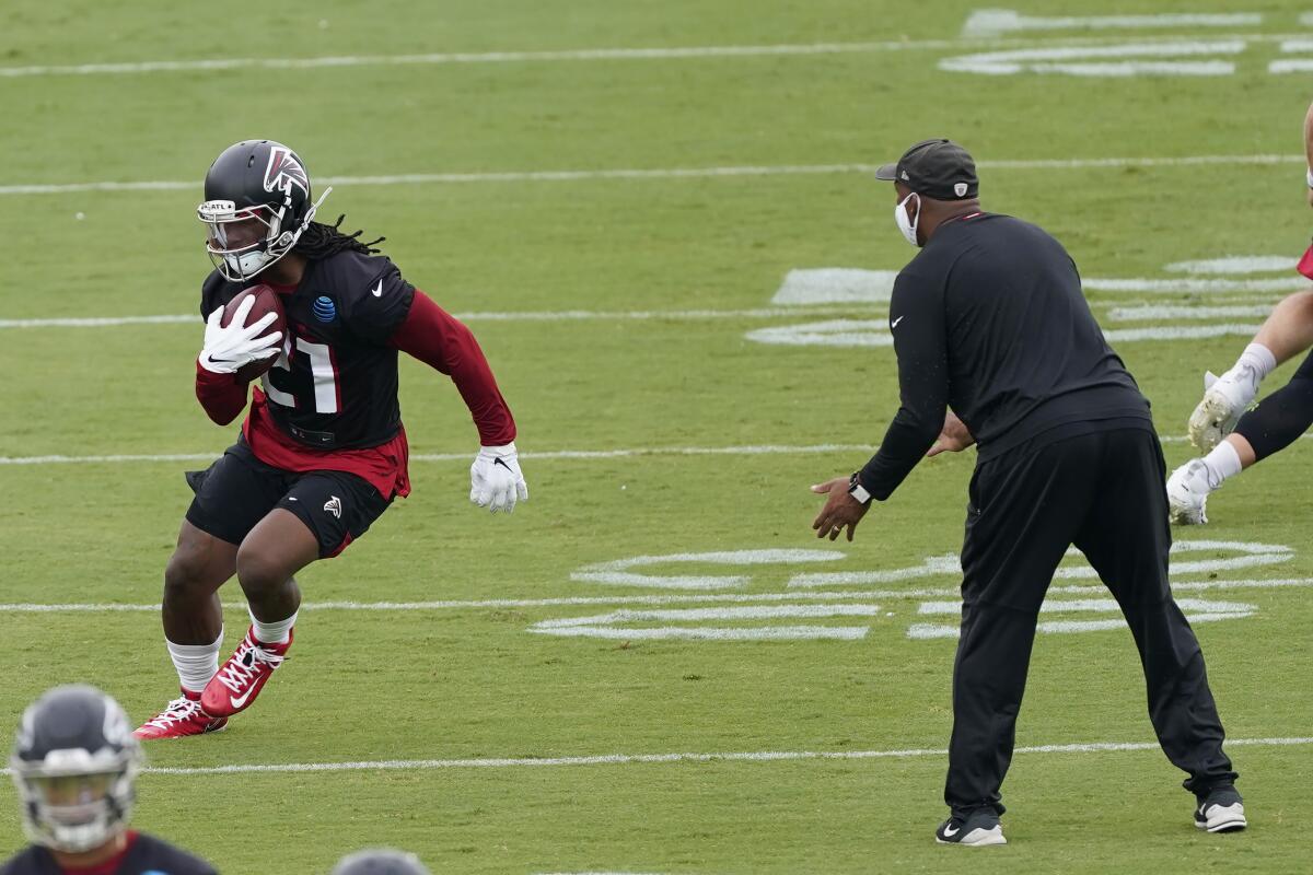 Atlanta Falcons running back Todd Gurley II works with running backs coach Bernie Parmale.