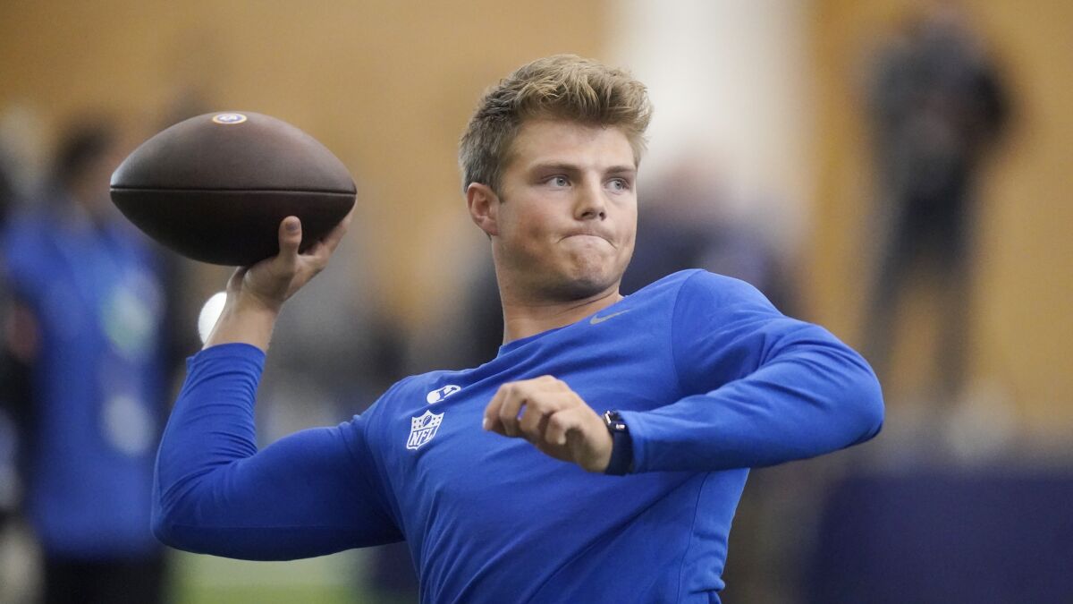 BYU Zach Wilson warms up before participating in his school's pro day.