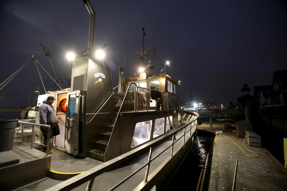 A sport-fishing boat at night. 