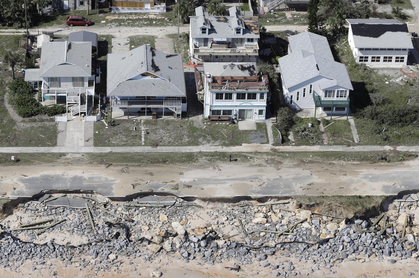 In this aerial photo, portions of SR A1A are washed out from Hurricane Matthew, Saturday, Oct. 8, 2016, in Flagler Beach, Fla. The damage from Matthew caused beach erosion, washed out some roads and knocked out power for more than 1 million customers in several coastal counties.